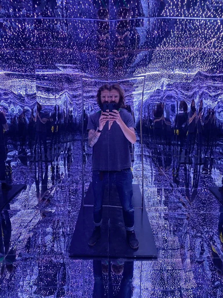 attendees filming an immersive LED environment on their phones at a corporate event
